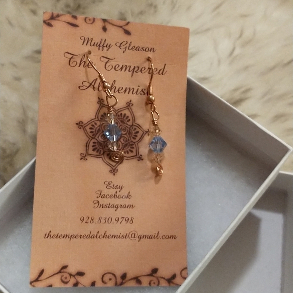 Beautiful delicate handmade earrings by a local artist. Gold with blue beads